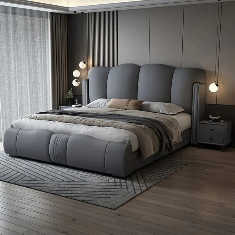Modern bedroom with a gray upholstered bed