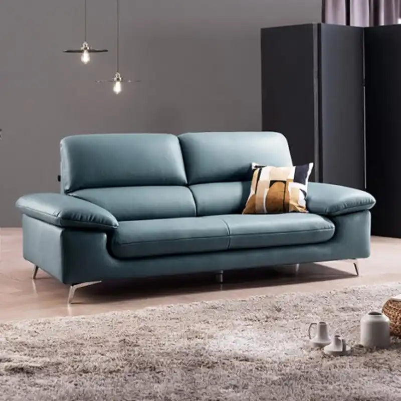 modern sofa with soft curved arms, supportive back cushions and raised chrome finish legs — front view in a bright living...