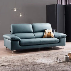 modern sofa with soft curved arms, supportive back cushions and raised chrome finish legs — front view in a bright living...