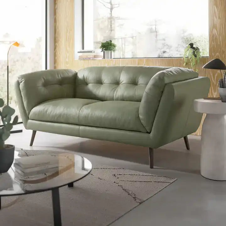 modern fabric sofa with rounded arms, soft cushions and slim raised legs — front view in a bright living room