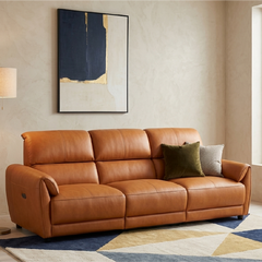 tan l shape sofa with deep cushions, supportive back panels and wide padded arms — angled view showing the full shape and...