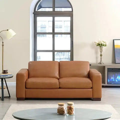 easy clean faux leather sofa with wide straight arms and thick supportive cushions — side angle showing the arms and raise...