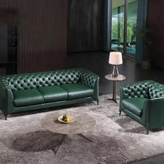 classic dark faux leather sofa with deep button details, high back and broad supportive arms — side angle showing the arms...