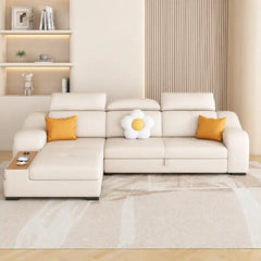 Sleeper sofa with side console and pull-out stool, with practical features for compact living spaces