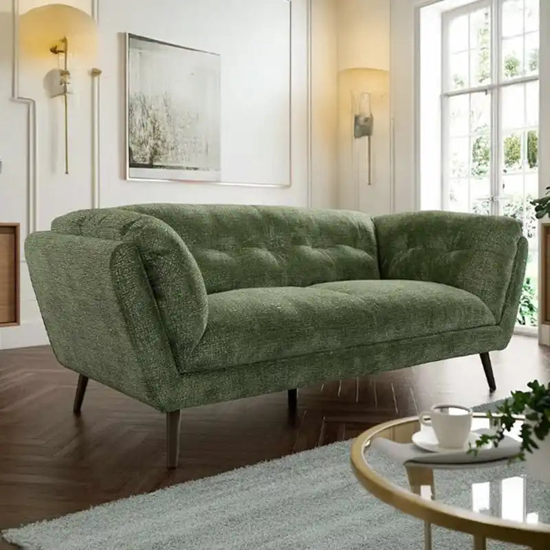 modern fabric sofa with rounded arms, soft cushions and slim raised legs — side angle showing the arms and raised base