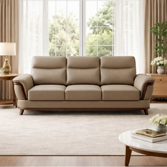 beige pure leather sofa with supportive back cushions, curved arms and refined wooden details — side angle showing the arm...