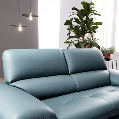 modern sofa with soft curved arms, supportive back cushions and raised chrome finish legs — side angle showing the arms an...