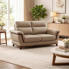 beige pure leather sofa with supportive back cushions, curved arms and refined wooden details — close view showing the cus...