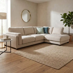 modern neutral fabric sofa with wide padded arms, thick cushions and clean straight lines — close view showing the cushion...