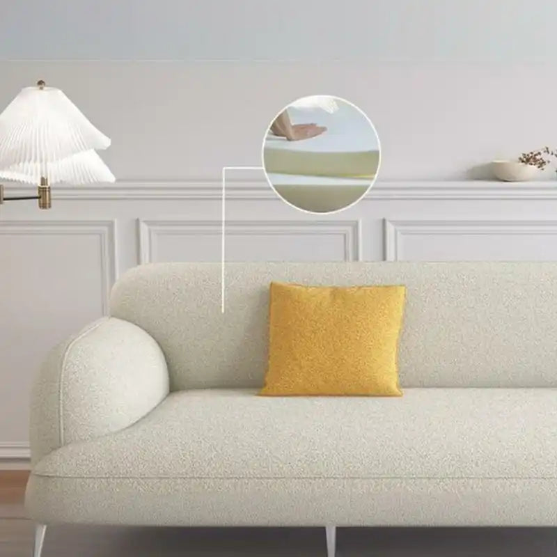 rounded fabric sofa with deep cushions, soft wide arms and a clean modern finish — close view showing the cushion and surf...