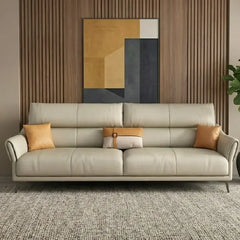 beige leatherette sofa with supportive high back cushions, rounded arms and slim raised legs — close view showing the cush...