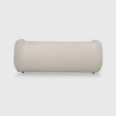 warm mustard rounded sofa with deep square cushioning and a soft textured finish — wide room view showing the complete sea...