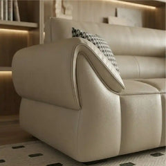 wide leatherette sofa with deep square cushioning and a low relaxed shape — wide room view showing the complete seating la...