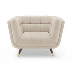 beige fabric sofa with soft curved arms, square cushion details and raised wooden legs — wide room view showing the comple...