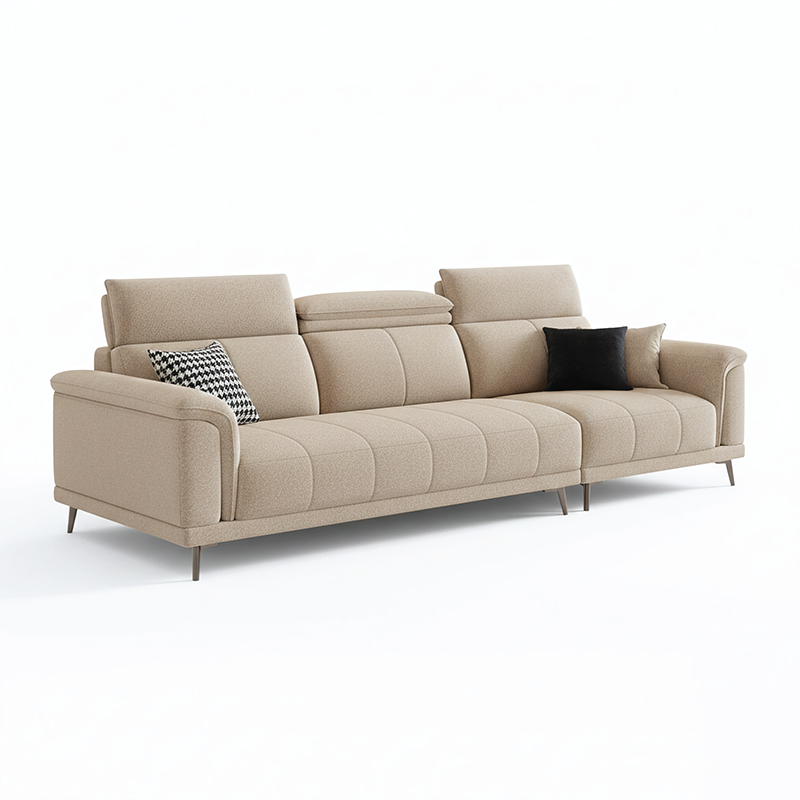 beige l shape sofa with adjustable head support, rounded arms and slim raised legs — full view with the complete shape cle...
