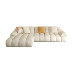 cream l shape sofa with deep soft cushions, rounded arms and a cosy low base — front angle showing the back support and ar...