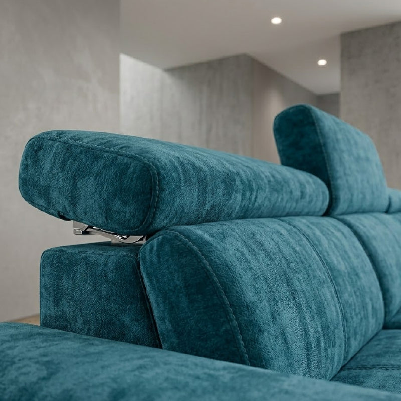 white l shape sofa with wide padded arms, supportive cushions and angled chrome finish legs — front angle showing the back...