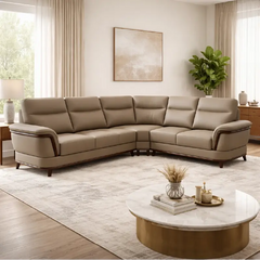 beige pure leather sofa with supportive back cushions, curved arms and refined wooden details — alternate angle showing th...