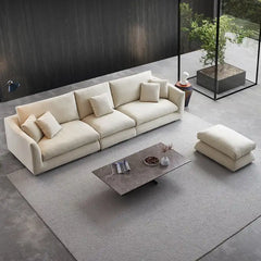 wide l shape fabric sofa with rounded arms, loose back cushions and deep comfortable seating — full view with the complete...