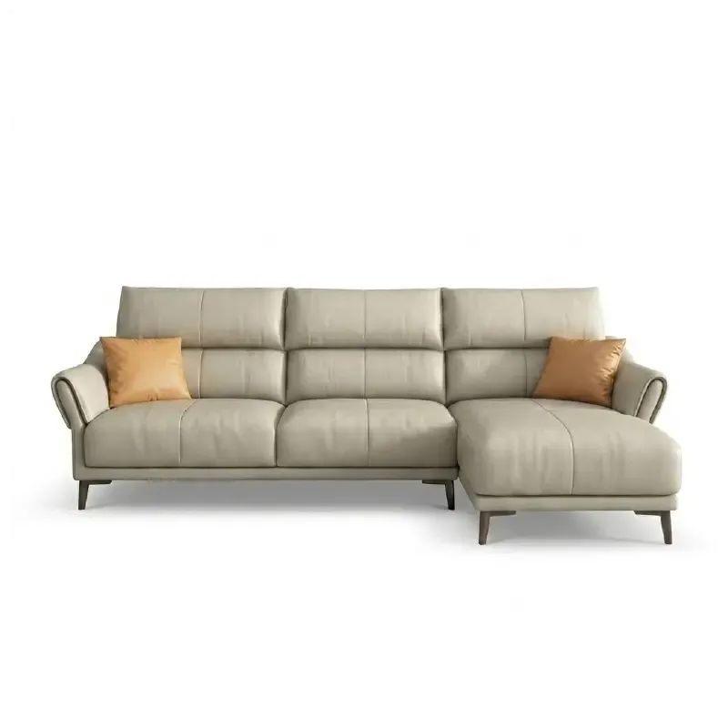 beige leatherette sofa with supportive high back cushions, rounded arms and slim raised legs — close view showing the colo...