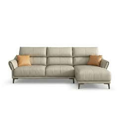 beige leatherette sofa with supportive high back cushions, rounded arms and slim raised legs — close view showing the colo...
