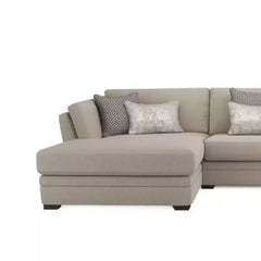 beige corner sofa with a compact l shape, soft cushions and a smooth fabric finish — room setting showing the relaxed seat...