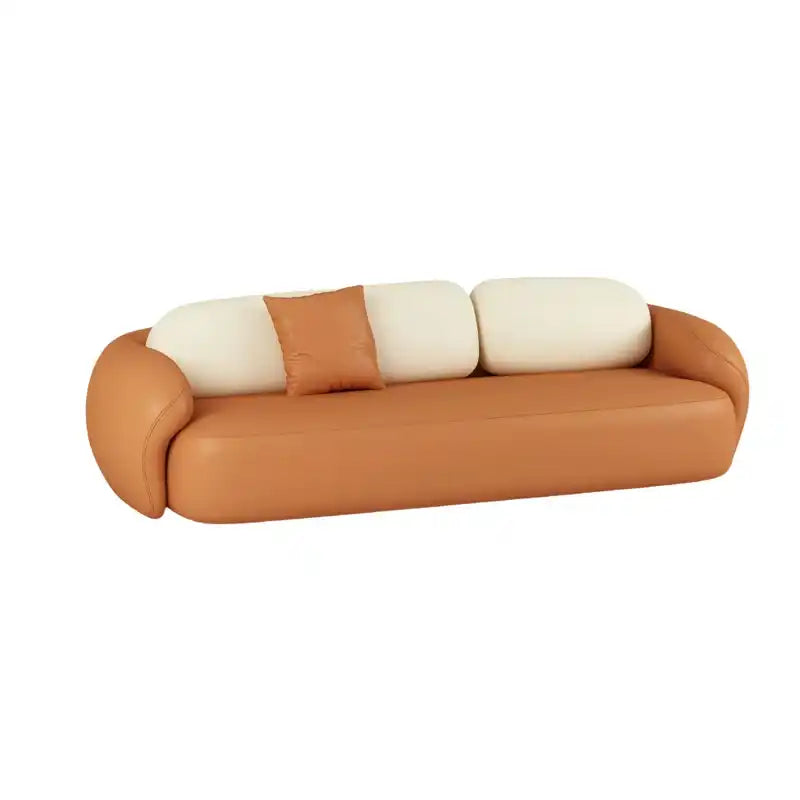 soft curved fabric sofa with cloud like cushions, wraparound arms and a low grounded base — room setting showing the relax...
