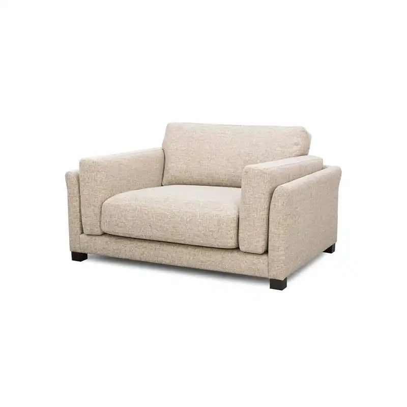 modern neutral fabric sofa with wide padded arms, thick cushions and clean straight lines — room setting showing the relax...