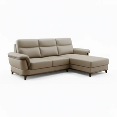 beige pure leather sofa with supportive back cushions, curved arms and refined wooden details — room setting showing the r...