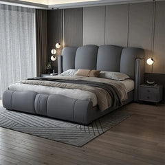 Modern bedroom with a gray upholstered bed