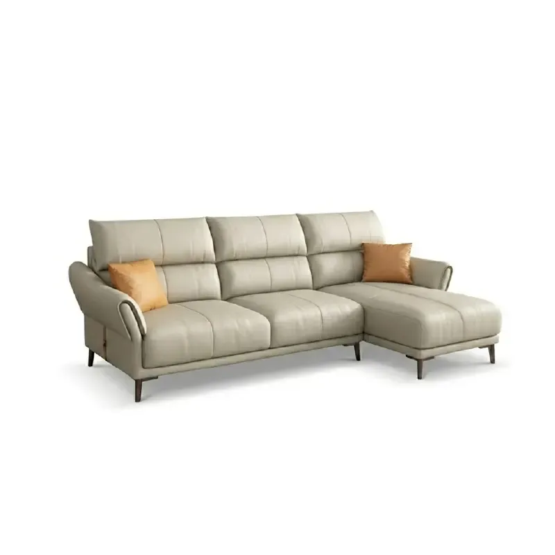 beige leatherette sofa with supportive high back cushions, rounded arms and slim raised legs — room setting showing the re...