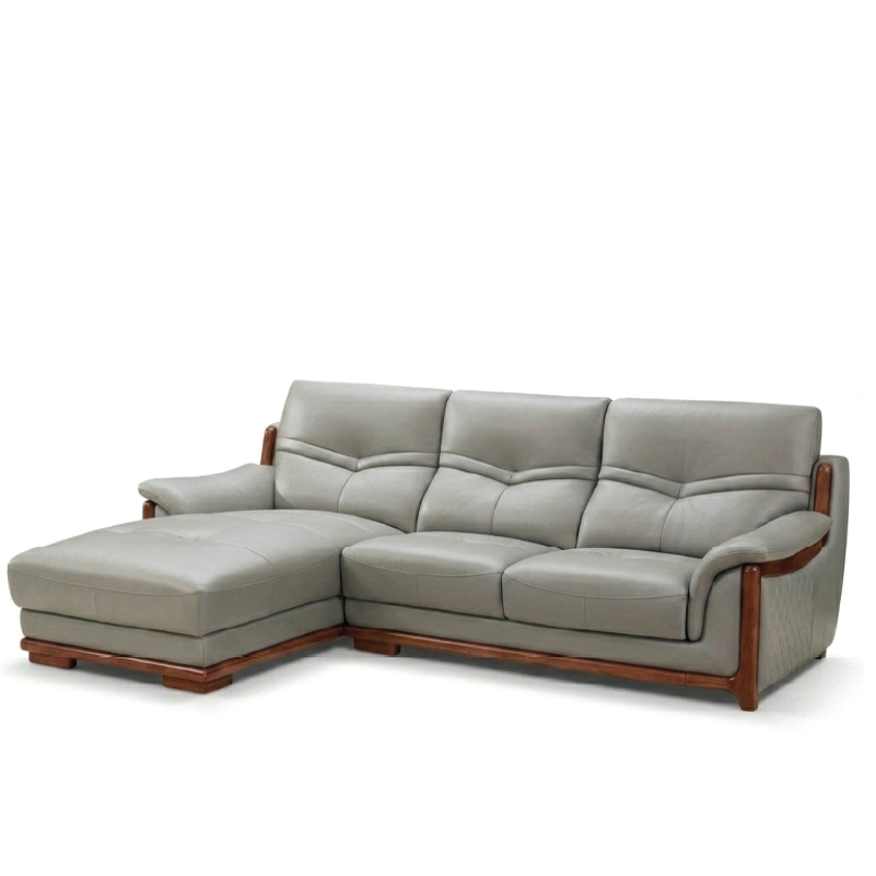 corner sofa with deep cushions, rounded arms and warm polished wooden side details — front view in a bright living room