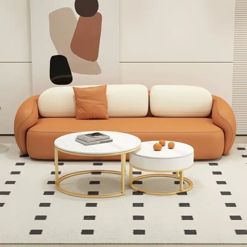soft curved fabric sofa with cloud like cushions, wraparound arms and a low grounded base — angled view showing the full s...