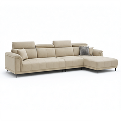 beige l shape sofa with adjustable head support, rounded arms and slim raised legs — side angle showing the arms and raise...