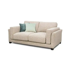 modern neutral fabric sofa with wide padded arms, thick cushions and clean straight lines — angled view showing the full s...