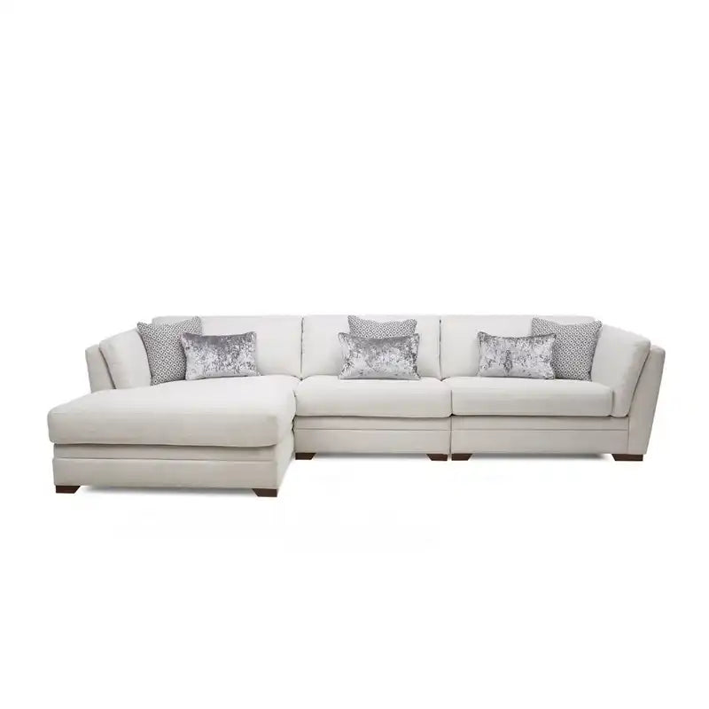 beige corner sofa with a compact l shape, soft cushions and a smooth fabric finish — angled view showing the full shape an...