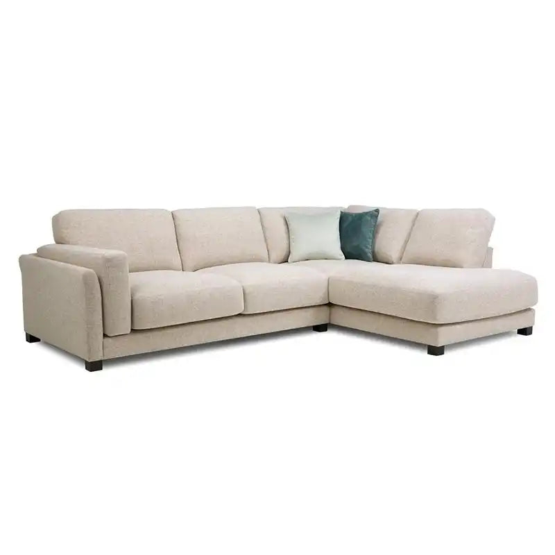 modern neutral fabric sofa with wide padded arms, thick cushions and clean straight lines — side angle showing the arms an...