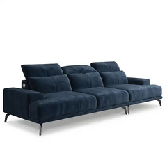 modern l shape sofa with high back cushions, slim metal legs and deep comfortable seating — wide room view showing the com...