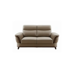 beige pure leather sofa with supportive back cushions, curved arms and refined wooden details — wide room view showing the...