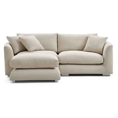 wide l shape fabric sofa with rounded arms, loose back cushions and deep comfortable seating — alternate angle showing the...