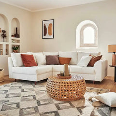 Sleeper sofa with a movable footstool, shown as a flexible seating and sleeping option