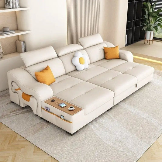 Sleeper sofa with side console and pull-out stool, shown as a flexible seating and sleeping option