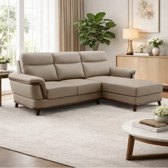 beige pure leather sofa with supportive back cushions, curved arms and refined wooden details — front view in a bright liv...