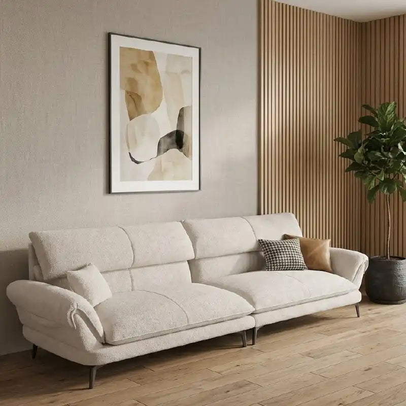 cream textured fabric sofa with curved arms, supportive back cushions and slim dark legs — front view in a bright living room