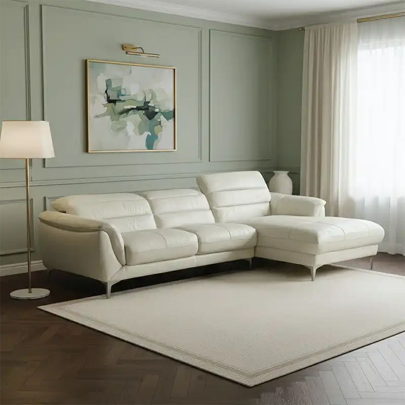 modern l shape sofa with high back cushions, soft rounded arms and slim raised legs — front view in a bright living room