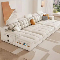 Smart convertible sofa bed with Bluetooth speakers, shown as a flexible seating and sleeping option