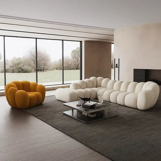soft curved sofa with rounded cushion sections, a cloud like shape and a low relaxed base — front view in a bright living...