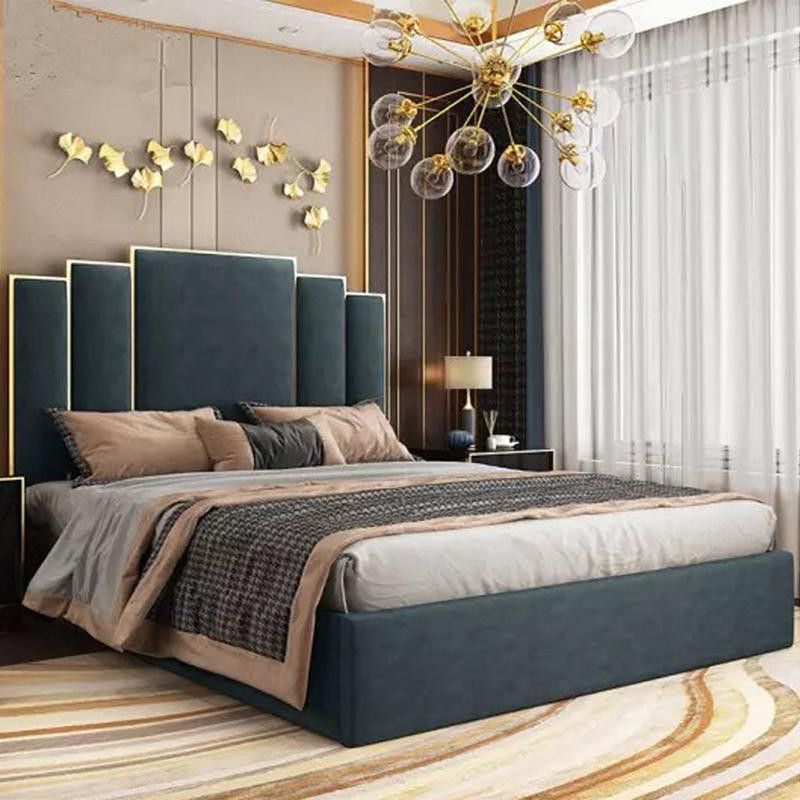 Designed with a plush velvet finish, this elegant bed frame features a geometric stepped headboard, metallic gold accents