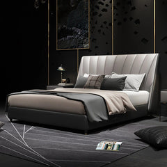 Indigo is a modern upholstered bed with a tall channel-tufted headboard,