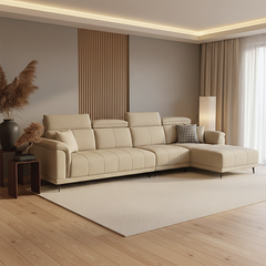 beige l shape sofa with adjustable head support, rounded arms and slim raised legs — wide room view showing the complete s...